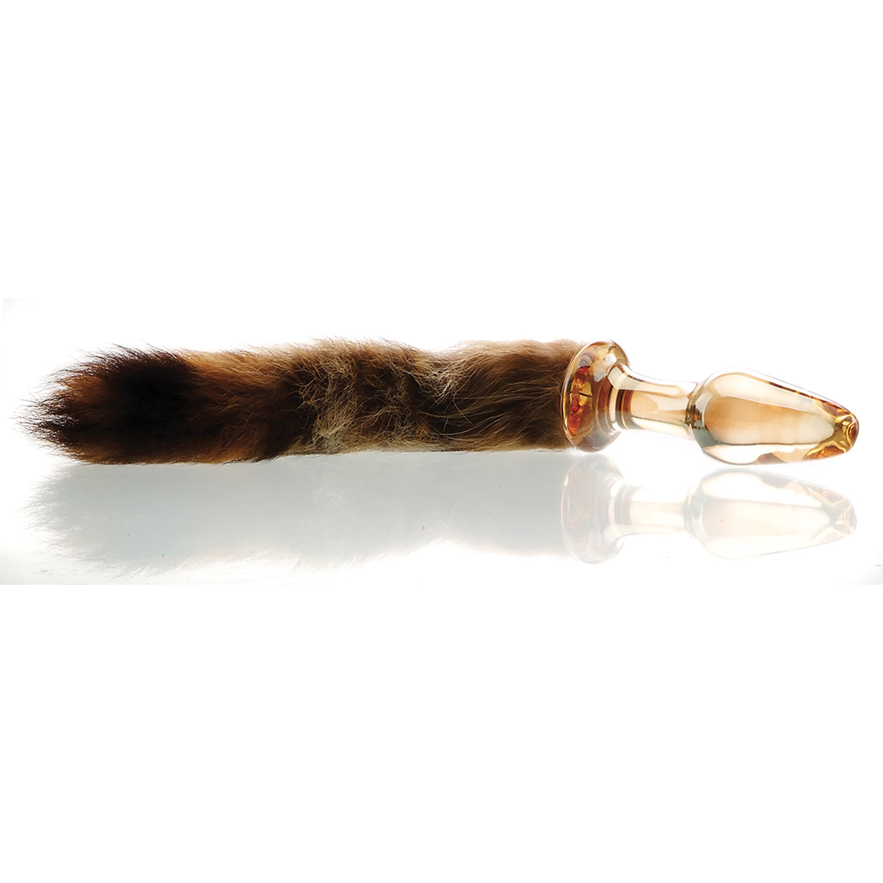 Foxxxy Fox Tail Glass Anal Plug laying on table