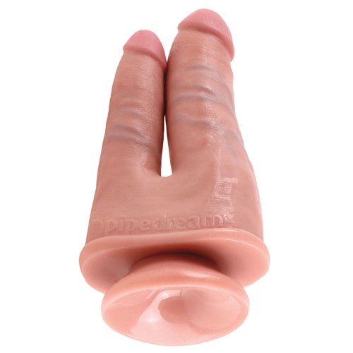 KingCock Double Penetrator Dildo laying on table