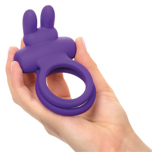 Adam & Eve Silicone Rechargeable Rockin' Rabbit Enhancer in hand