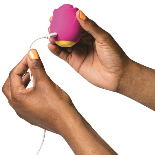 Romp Rose Clitoral Stimulator - Hand Shot to Show Size