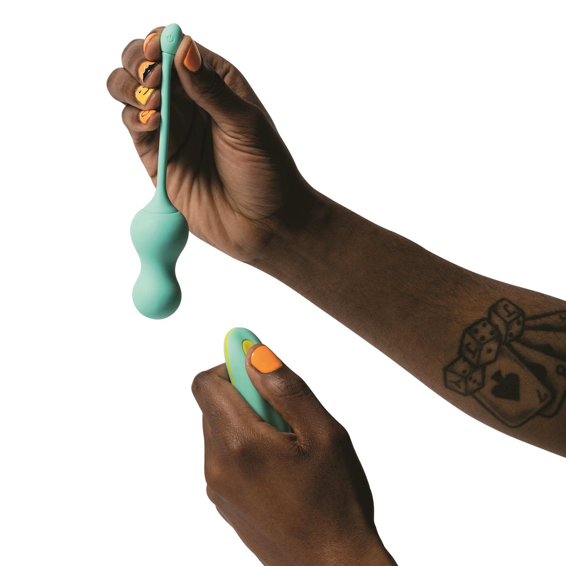 Romp Cello Vibrating Egg - Hand Shot with Vibrator and Remote