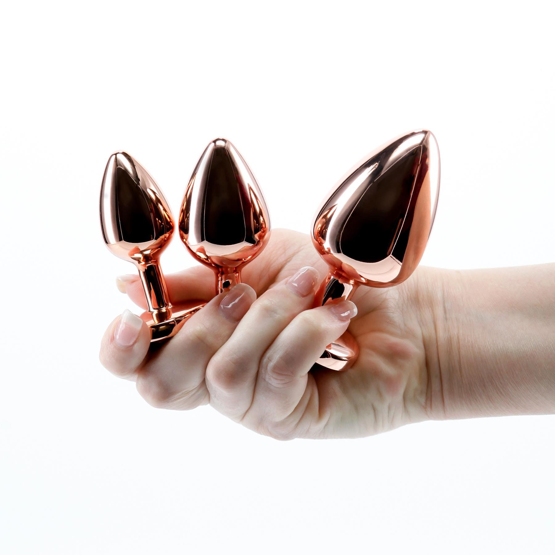 Adam & Eve Rose Gold Pink Heart Anal Training Set - Hand Shot to Show Size