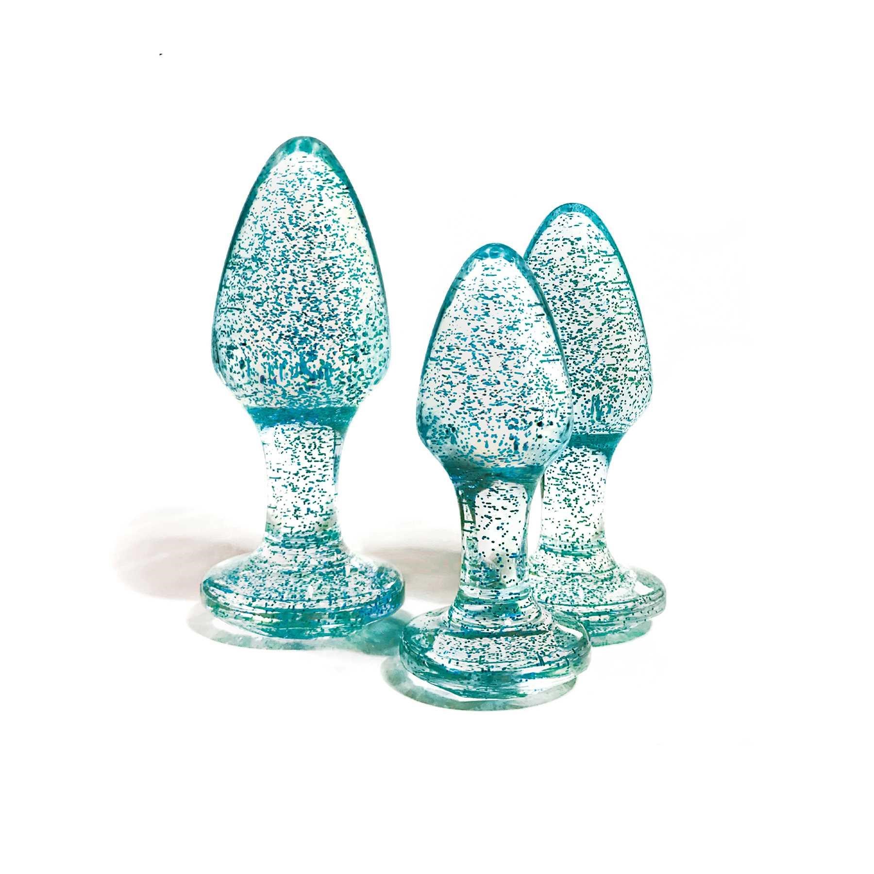 Glitter Gem Butt Plug Set standing on table blue