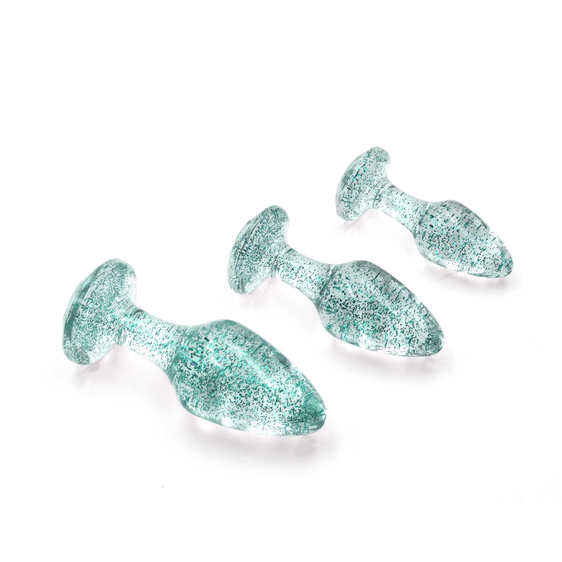 Glitter Gem Butt Plug Set laying on table blue