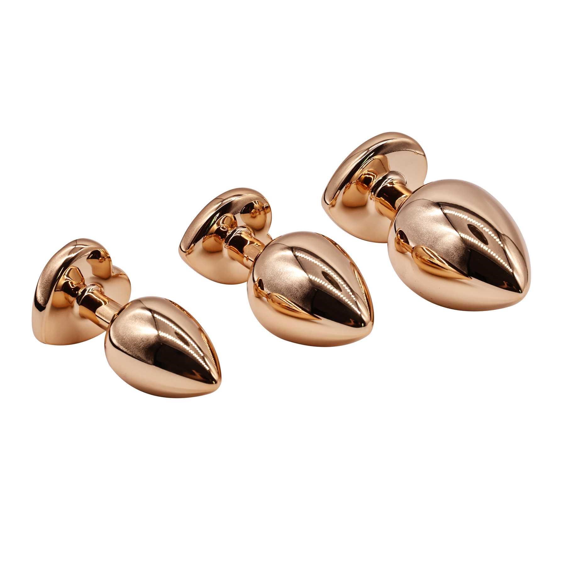 Adam & Eve Rose Gold Pink Heart Anal Training Set side view with plug ends