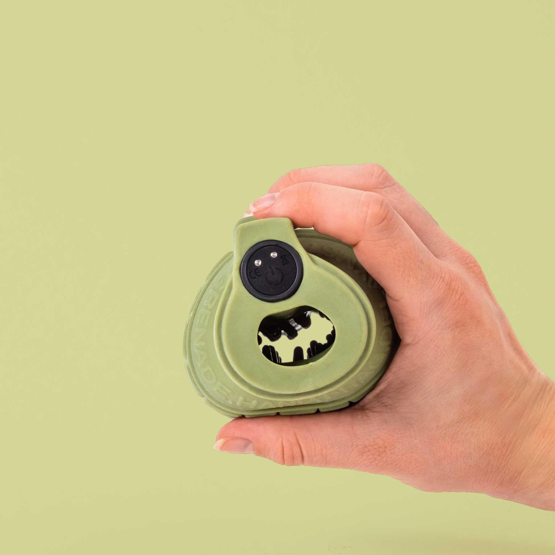 LA BOMBA VIBRATING MASTURBATOR hand holding showing top