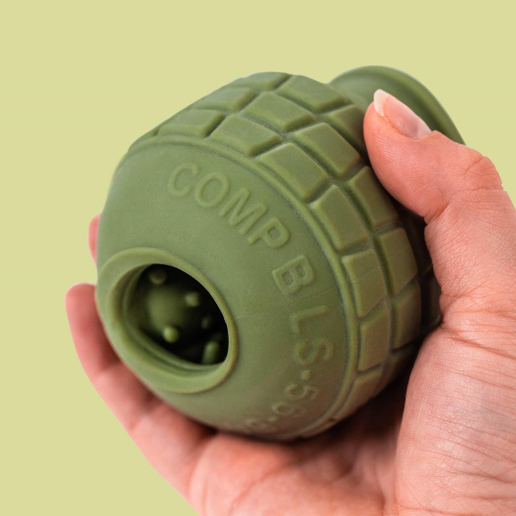 LA BOMBA VIBRATING MASTURBATOR hand holding showing bottom
