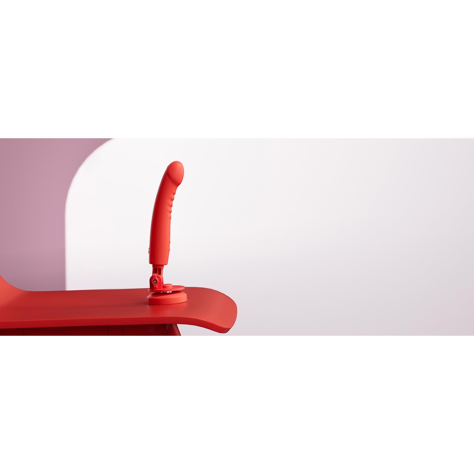 Lovense Mission 2 App Enabled Touch Sensitive Vibrator showing suctioned to a table