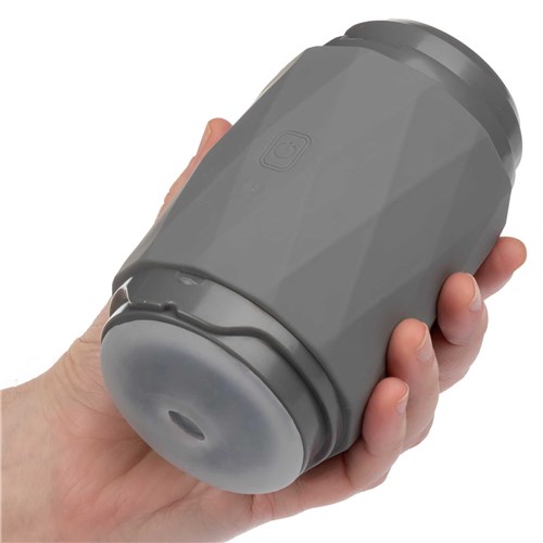 Milk Master Vibro Squeeze Stroker hand holding for scale