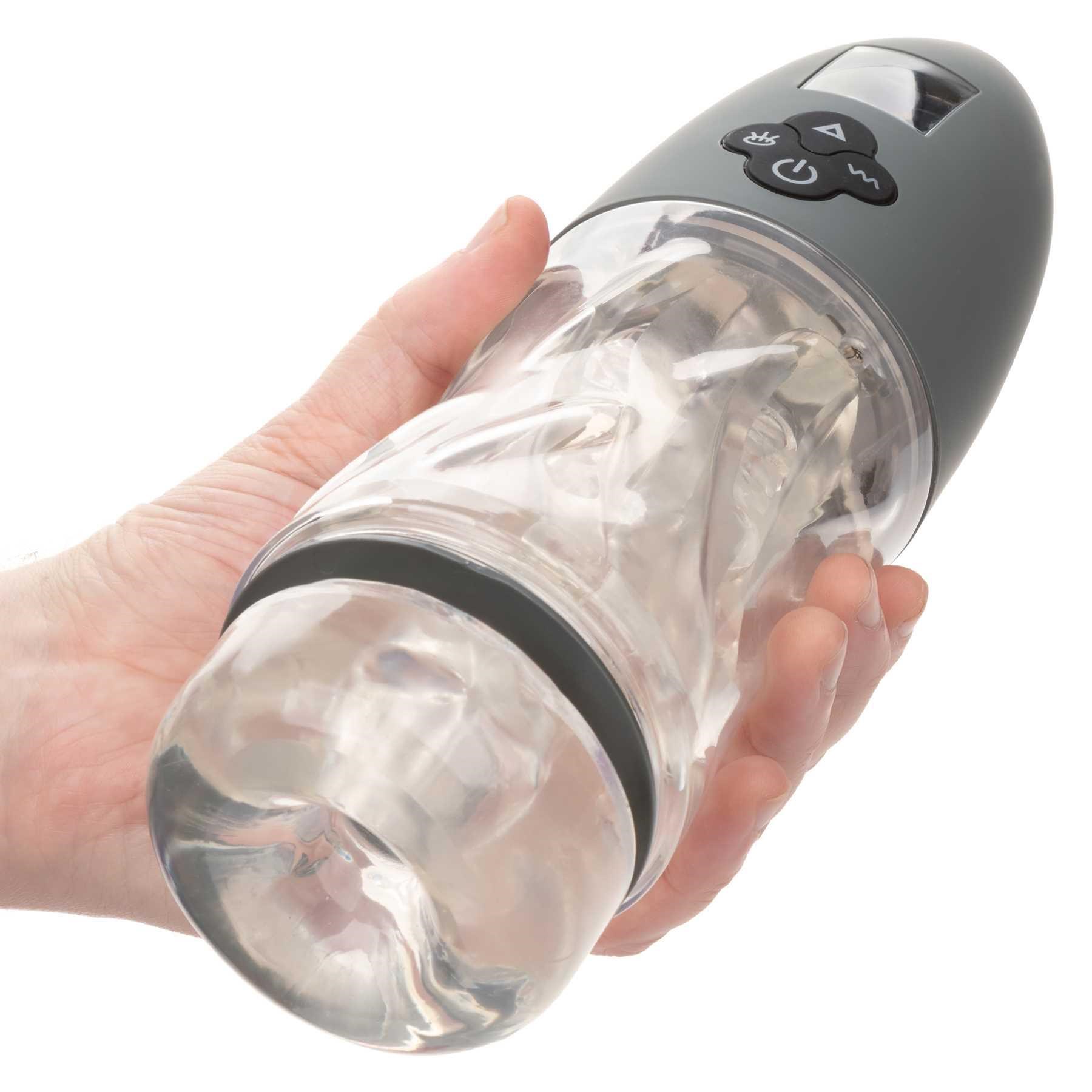MILK MASTER™ EXTREME AUTOMATIC MILKER hand holding for scale