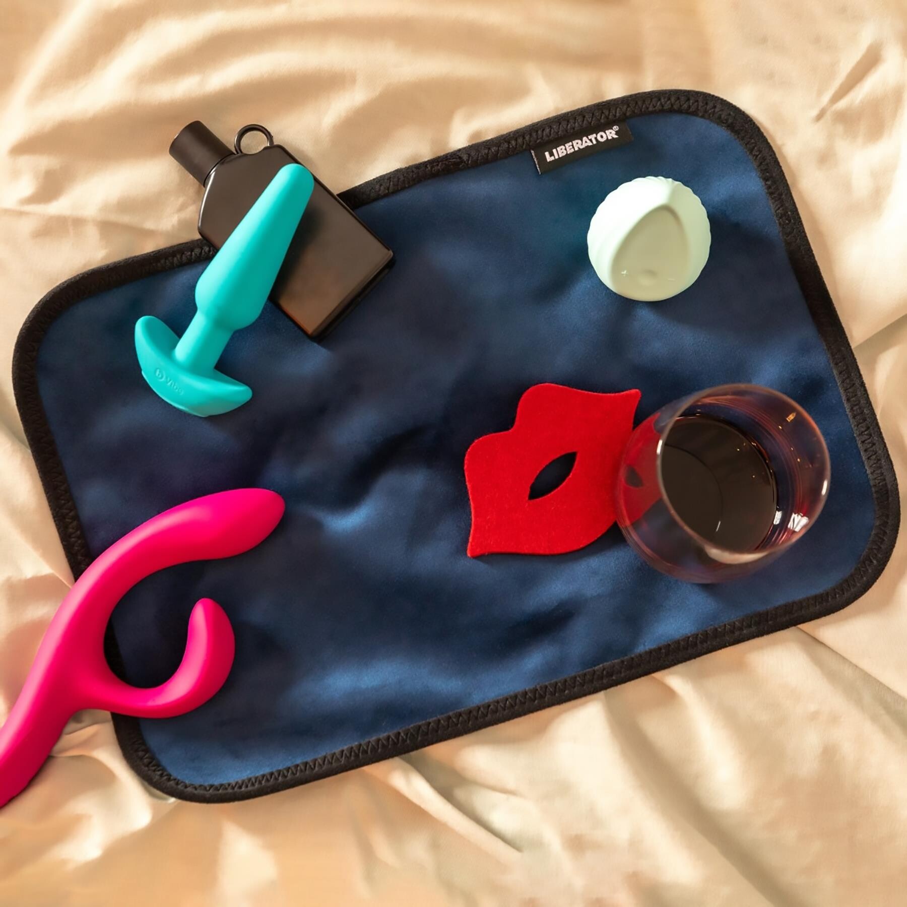 Liberator Fascinator Toy Pad with toys on pad