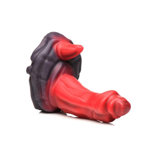 CREATURE COCKS OGRE SILICONE DILDO laying on table