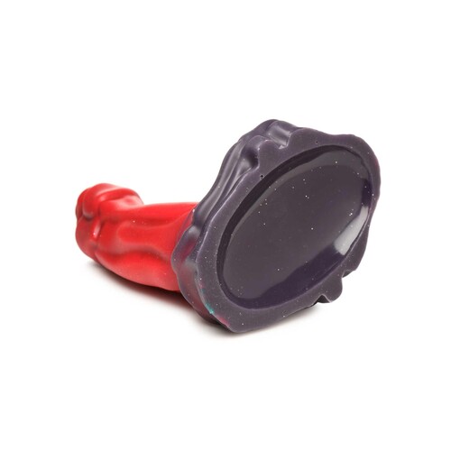 CREATURE COCKS OGRE SILICONE DILDO laying on table showing base end