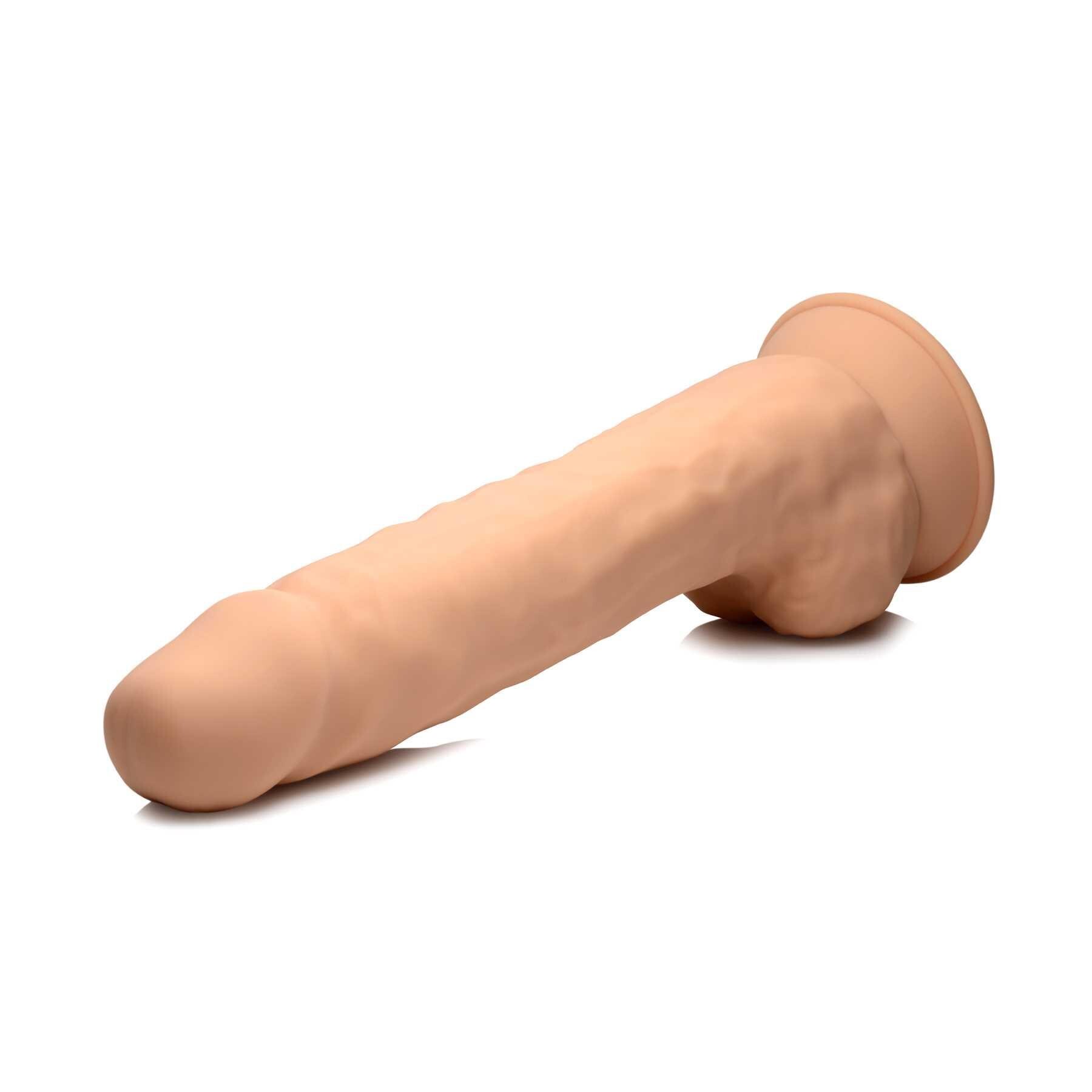 FLESHSTIXXX 10 SILICONE DILDOS w/BALLS laying on table