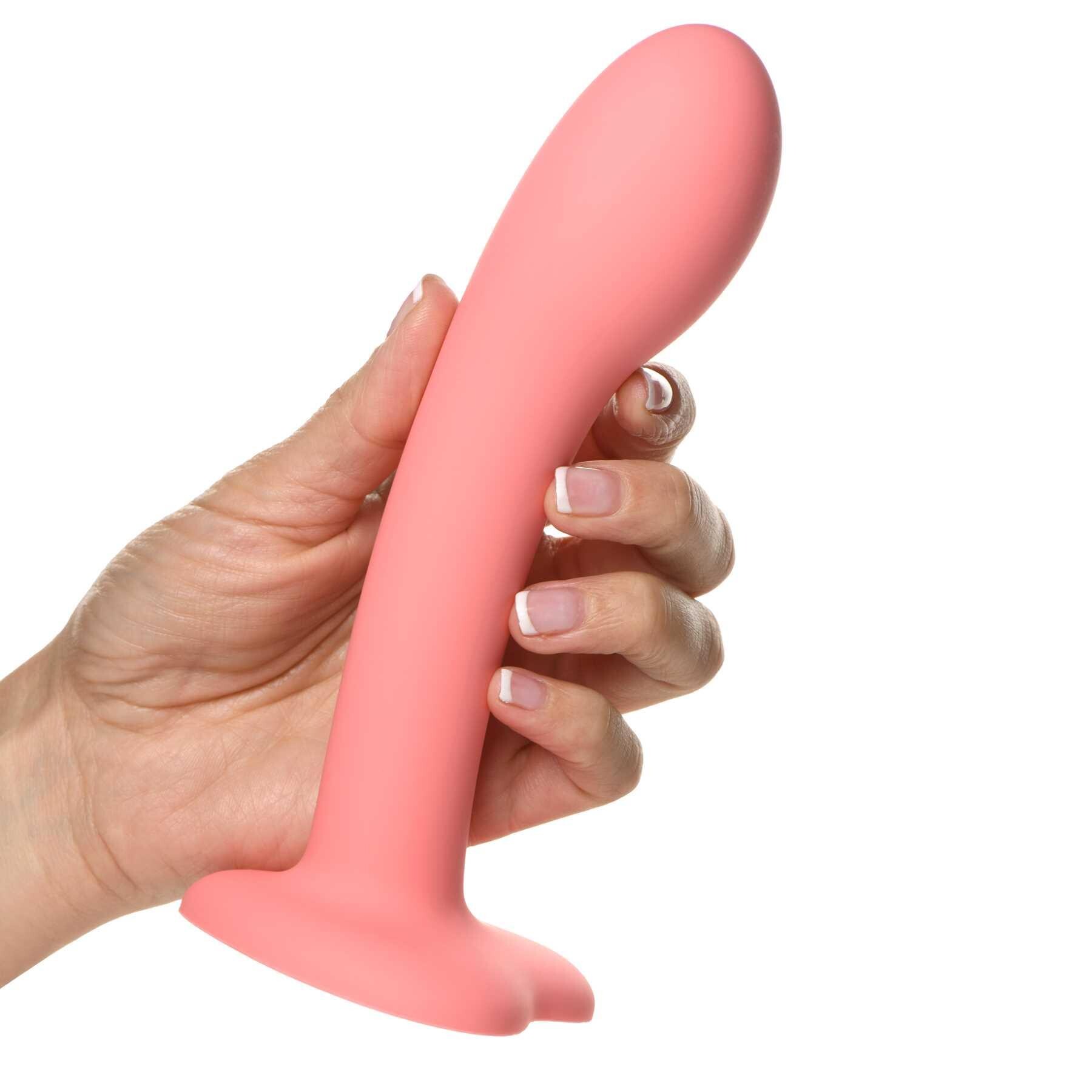 Simply Sweet G-Spot Silicone Dildo hand holding for scale