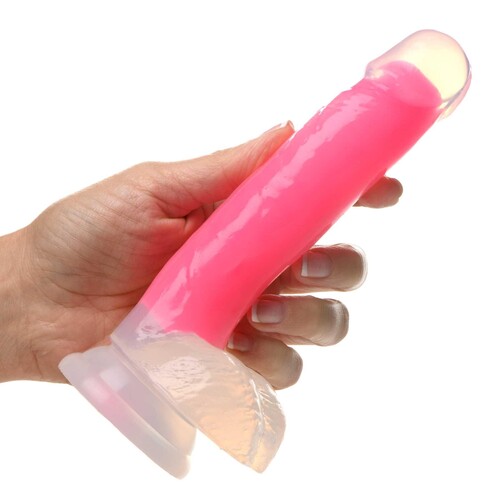 7 Glow-in-the-Dark Silicone Dildo w Balls pink hand holding for scale