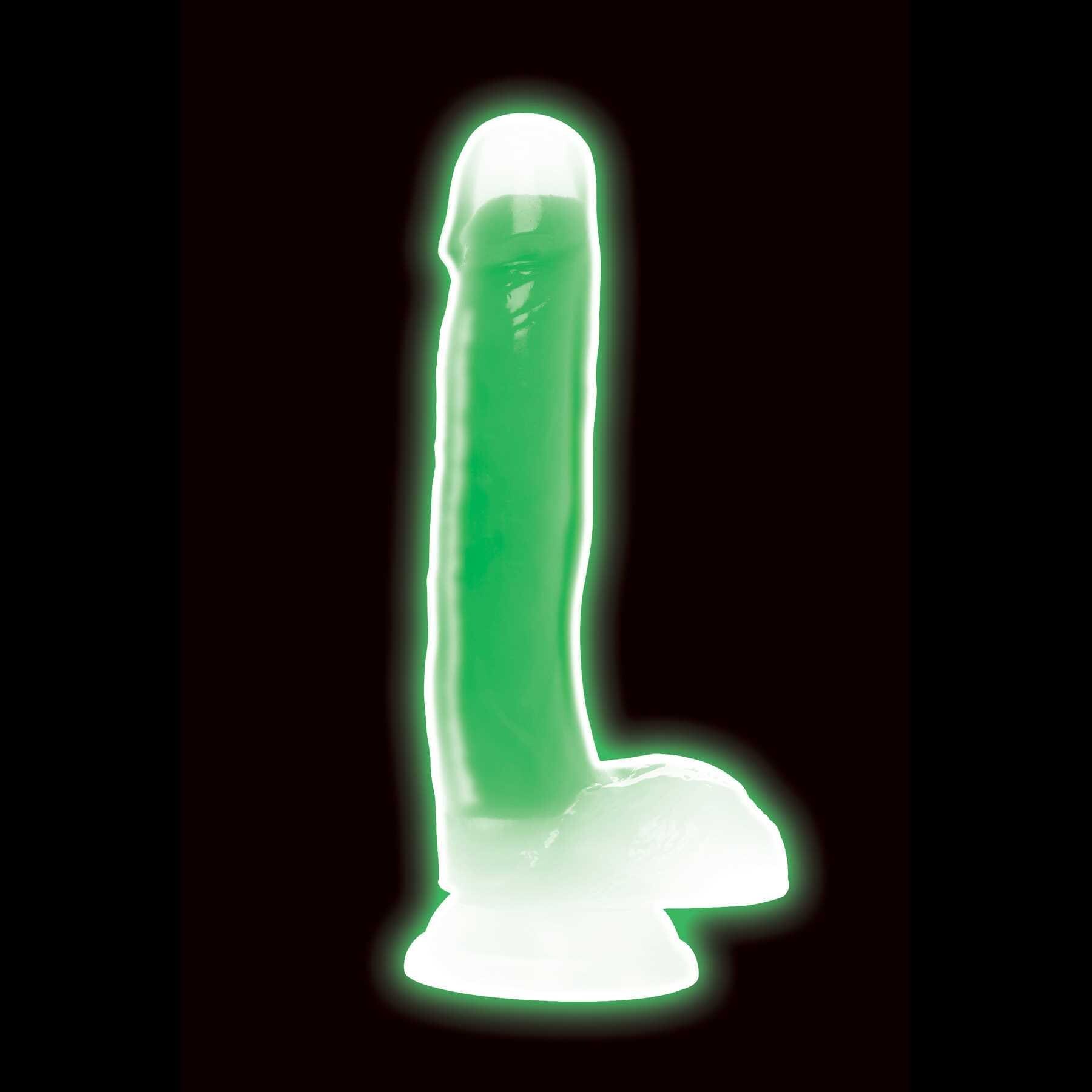 7 Glow-in-the-Dark Silicone Dildo w Balls green glowing standing on table