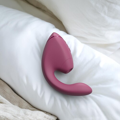Womanizer Next Duo Dual Stimulator - Lifestyle Shot on Bed