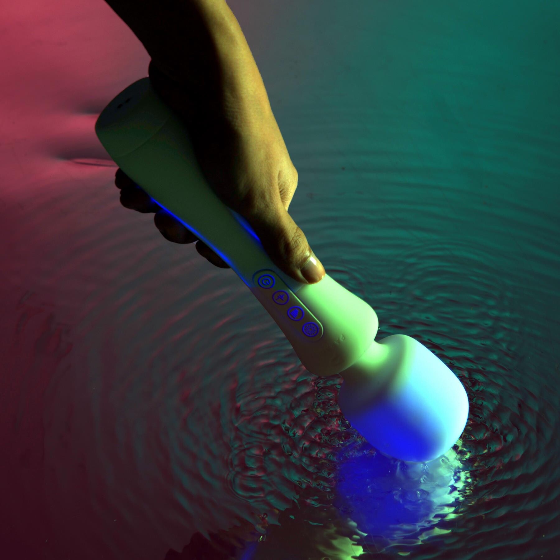 Illumination Wand Massager showing wand head touching water