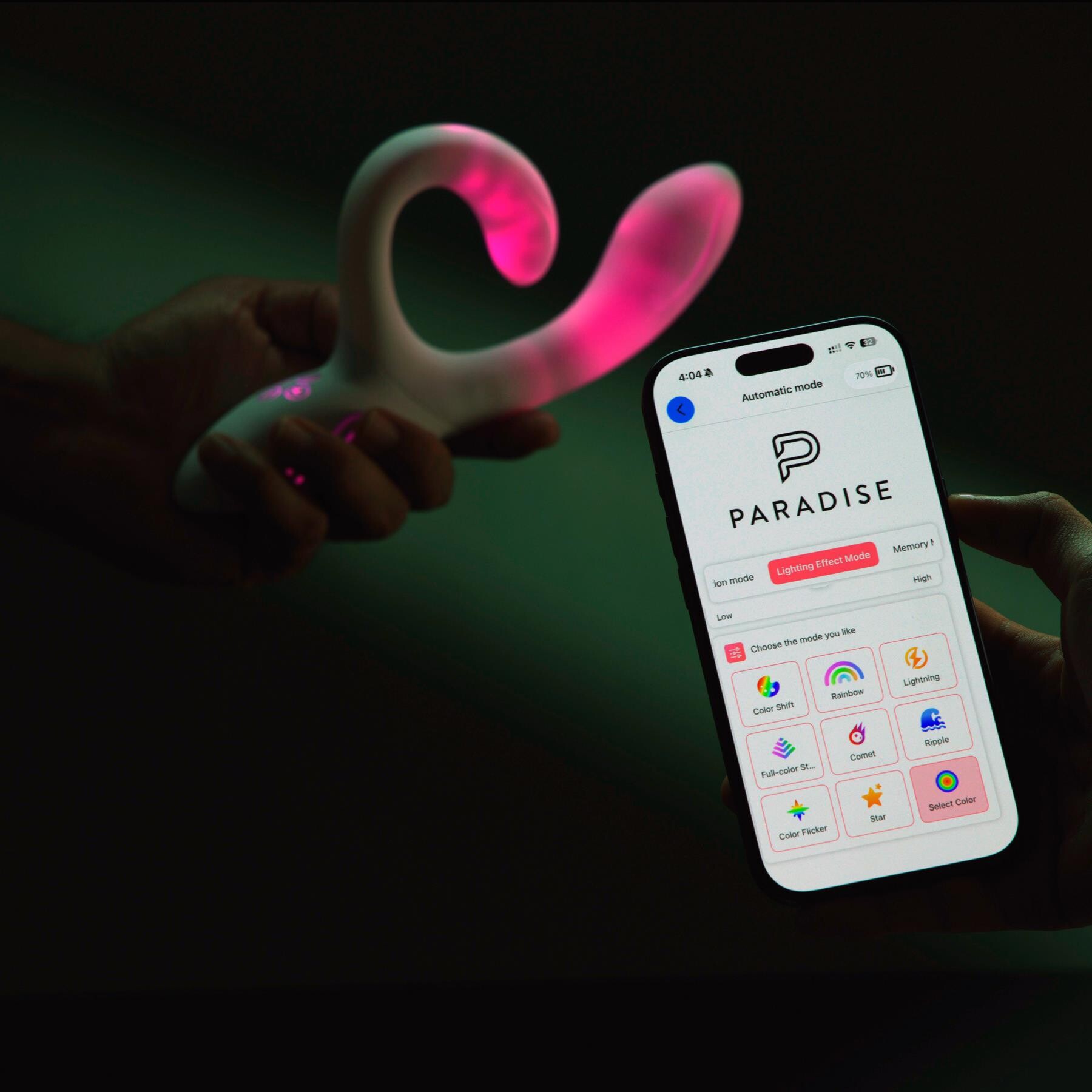 Illumination Rabbit Vibrator in hand with phone displaying the app