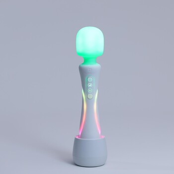 Illumination Wand Massager full view glowing on stand