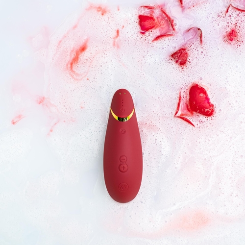 Womanizer Premium 2 Clitoral Stimulator - burgundy with moody background