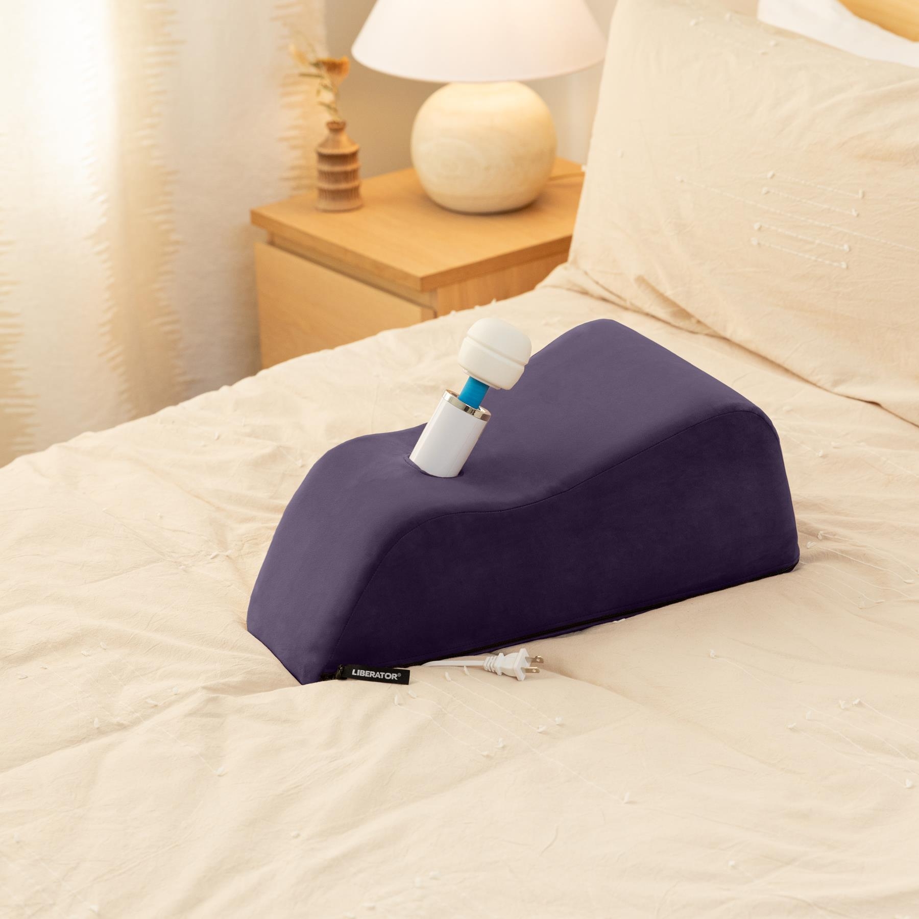 LIBERATOR WANDA with toy inserted on bed