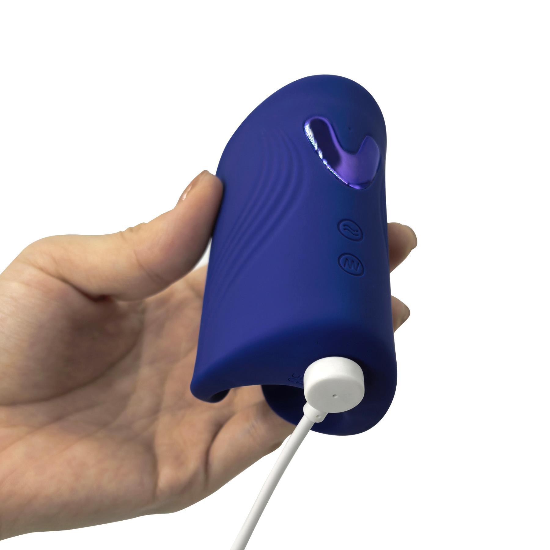 Grip It Male Trainer - Hand Shot - Showing Where Charging Cable is Placed